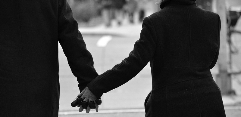 Couple holding hands